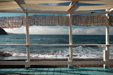 Empty terrace on warm summer evening sunset over the sea. Holiday, vacation and travel concept
