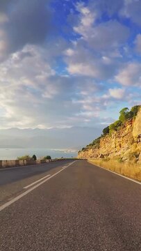 Summer holiday traveling, Mediterranean coastline, seaside village, sunny day, POV car driving, vertical video, reel