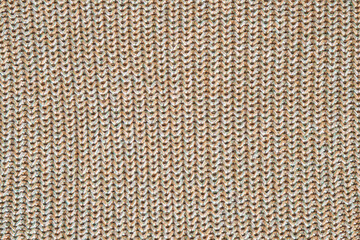 Seamless marl wool knitting pattern. White and light brown with green thread melange yarn fabric knitted texture. Up close