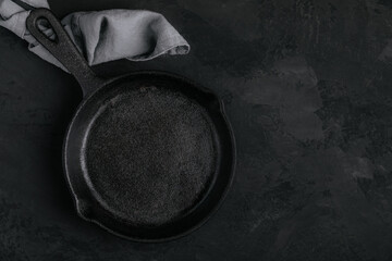 Roast Pan. Empty cast iron frying pan on dark stone background