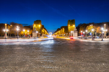 Fototapeta na wymiar Avenue des Champs-Elysees and Arc de Triomphe at dusk, Paris. France