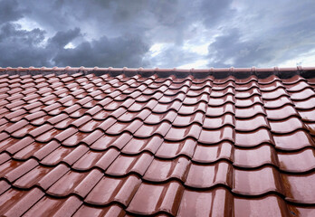 Concept for roof housetop icon with maroon (dark red) ceramic roofing tiles. Banner texture for...