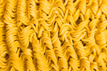 Pattern, raw instant noodles macro, flatlay. Fast food in the modern world.