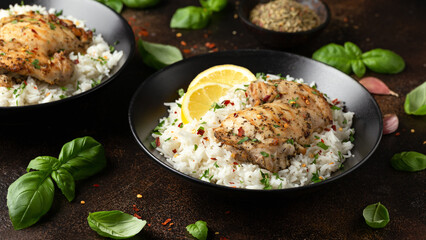 Grilled Chicken thighs served with rice in a black bowl