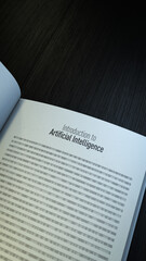 Artificial Intelligence concept. Opened book introducing AI with binary code page. 3d rendering. Vertical Orientation.