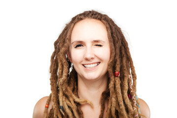 portrait of a caucasian girl with dreadlocks hairstyle winking
