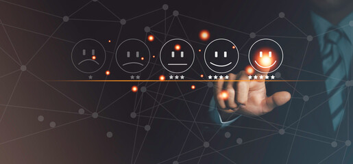 Businessman pressing smiley face emoticon on virtual touch screen Customer service appraisal concept satisfaction concept