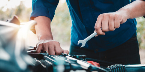 Mechanic open vehicle hood checking up auto mobile, fixing a car at home,Repair and service