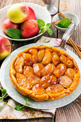 Traditional French apple pastry tarte tatin served as close-up on a design plate