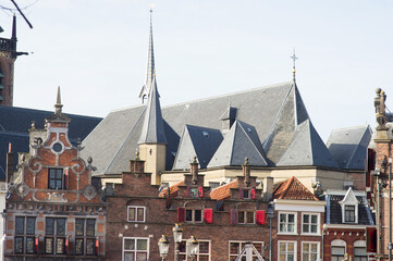 Obraz premium Roofs of a historic buildings in the center of Nijmegen with in the background the Stevenskerk in the Netherlands
