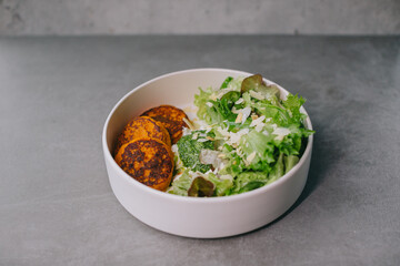 Food on an elegant white plate, lunch or dinner dish. Delicious food in a restaurant close-up.