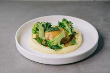 Food on an elegant white plate, lunch or dinner dish. Delicious food in a restaurant close-up.