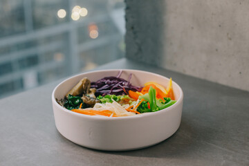 Poke bowl with vegetables, rice and mushrooms.
