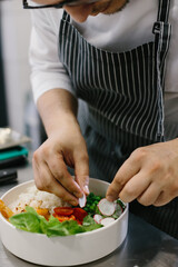 Cropped view of chef preparing food, food, in kitchen, chef preparing food, chef decorating dish, close-up