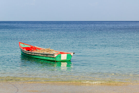 a fishing boat on turquoise water