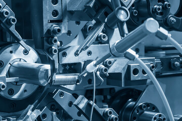 Close up scene the coil spring machine in light blue.