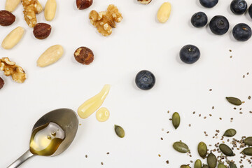 Nuts, seed and fruits on white background