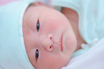 sleeping child looking forward