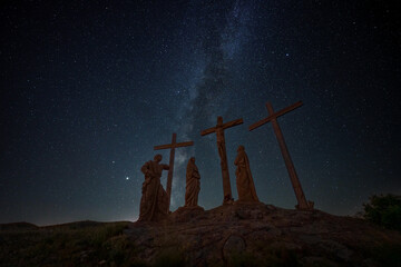 Crucifixion of Christ scene on top of a hill against starry night