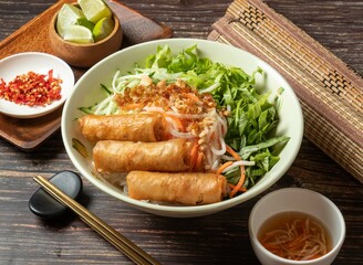 Fried Spring Rolls Cold Rice Vermicelli with sauce served in bowl isolated on table top view of taiwan food - obrazy, fototapety, plakaty