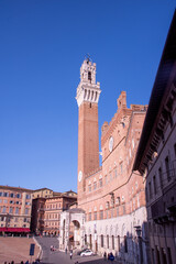 Obraz premium Piazza del Campo (Campo square), Palazzo Publico and Torre del Mangia (Mangia tower) in Siena, Tuscany, Italy