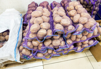 Fresh organic potatoes packed in bags