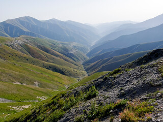 Naklejka premium A nice view over a river in the middle of the mountains in the dusty air.