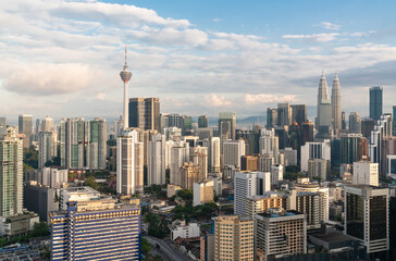 Fototapeta na wymiar Magnificent Kuala Lumpur panorama with Petronas twin towers and Menara telecommunication tower
