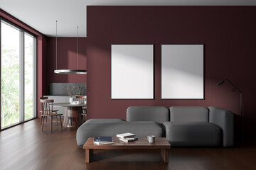 Dark red living room and kitchen interior with posters