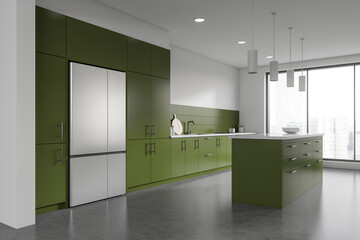 White and green kitchen with island and fridge