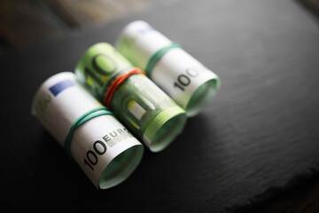 100 euro banknote pack and wood bankground. Currency, financial