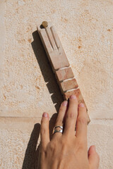 A woman touches a Jewish traditional mezuzah