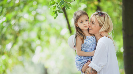 Mother and daughter having fun and enjoying in nature-pure love