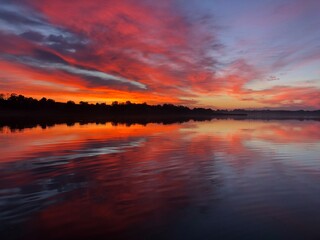Fototapeta na wymiar Sunrise over a quiet lake
