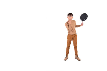 Cheerful attractive chef. Guy with a frying pan on a white background.