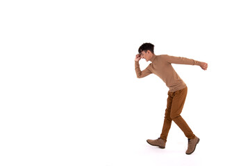Fototapeta na wymiar Funny guy is dancing on a white background. Human emotions. Isolate.