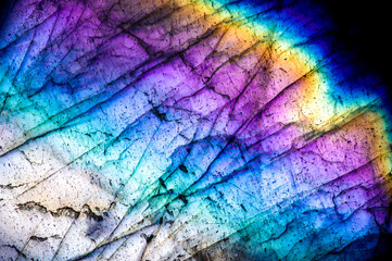 Labradorite iridescence with beautiful rainbow color. macro detail texture background. close-up...