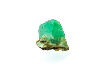 emerald crystal isolated on white background. macro detail texture background. close-up raw rough unpolished semi-precious gemstone