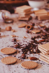 Cookies and dry tea leaves on a kitchen table