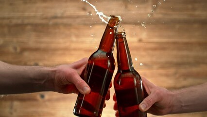 Super Slow Motion Shot of Beer Bottles Cheering and Splashing at 1000fps.