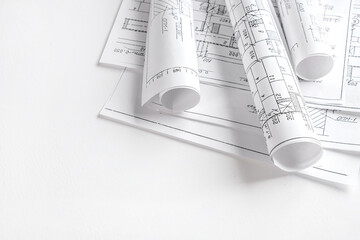 Architects concept, engineer architect designer freelance work on start-up project drawing, construction plan architect design working drawing sketch plans blueprints and making construction model