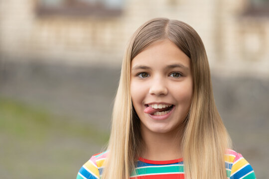portrait of cheerful teen girl with blonde hair. portrait of teen girl outdoor.