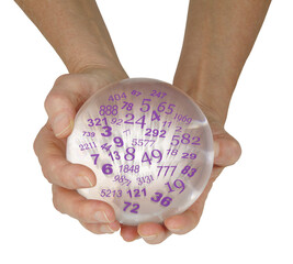 Seeking this weeks' winning lottery numbers concept - hands holding a large crystal ball containing...