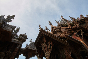 Fototapeta na wymiar A temple with a red roof and a blue sky in the background.