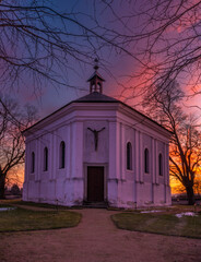 Winter sunset with color sky near Andelska Hora village with ruins and chapel
