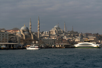 Fototapeta na wymiar View of the Fatih district of Istanbul from the water of the Golden Horn Bay, Suleymaniye Mosque, New Mosque on a sunny day,Istanbul, Turkey