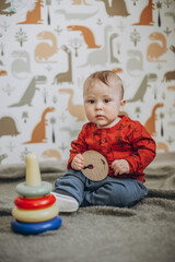 Naklejka premium little boy playing in the children's room