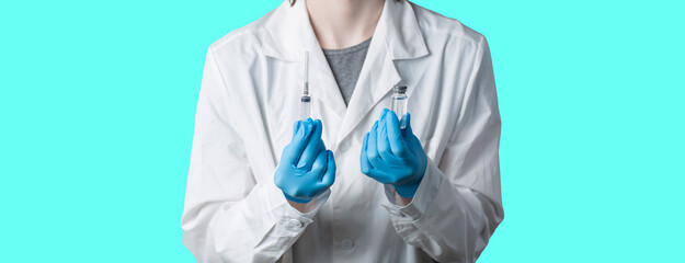 The doctor does the vaccination.A doctor with an injection and a dose of vaccine.