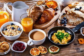 Breakfast served with coffee, eggs, cereals nd croissants