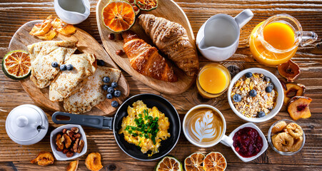 Breakfast served with coffee, eggs, cereals nd croissants
